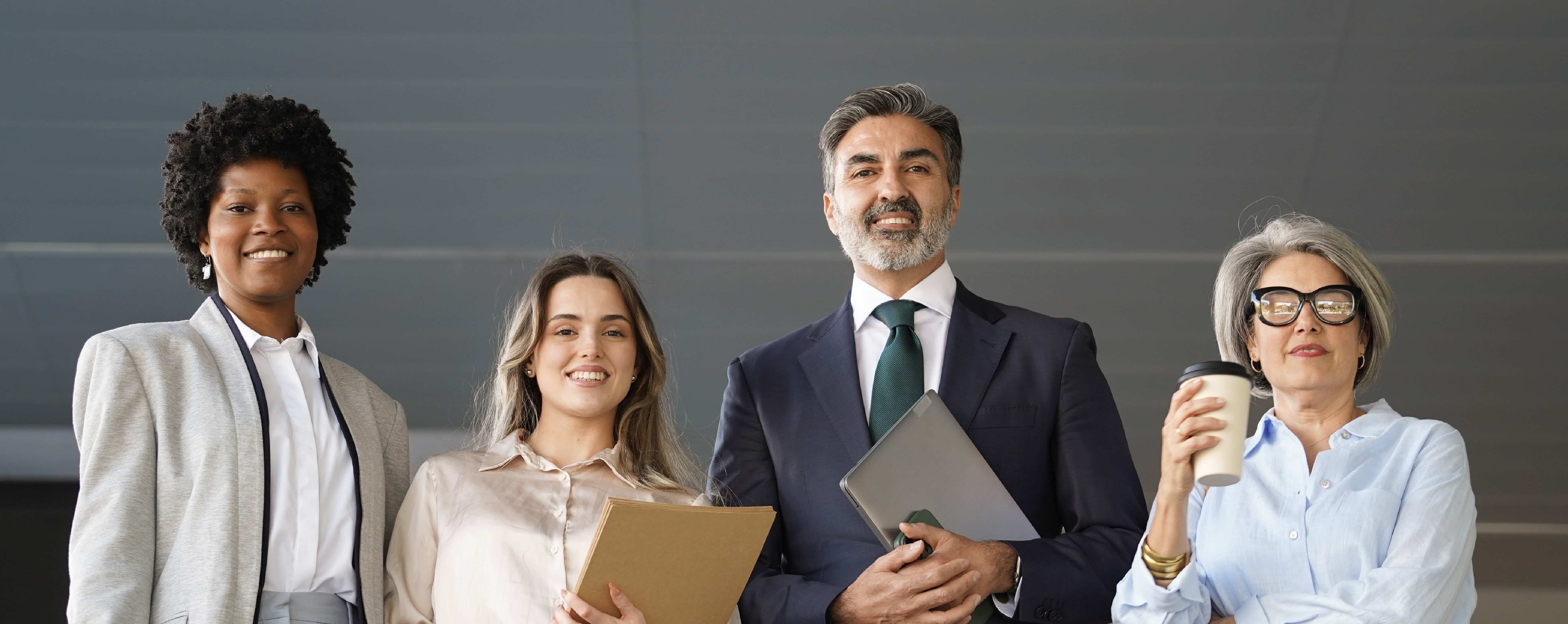 A company's leadership team standing together.